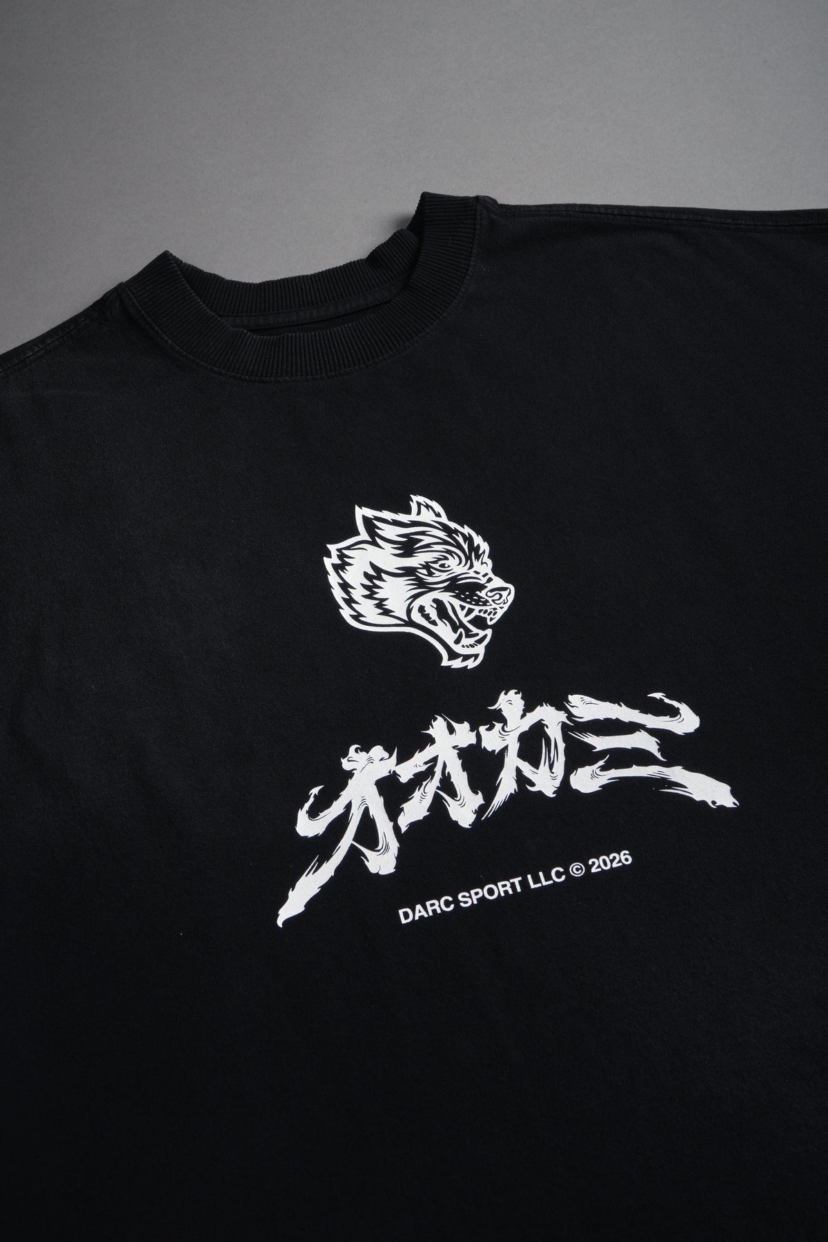 OKAMI BUSHIDO GRUNGE CUT-OFF MID LENGTH RAW HEM TEE IN BLACK SUN FADE