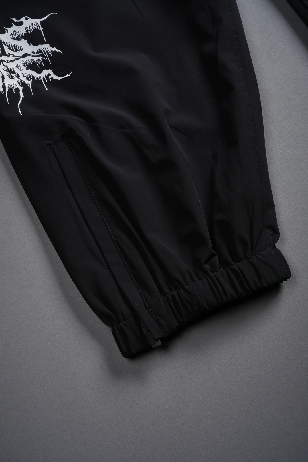 SHADOW HYBRID NYLON TRACK PANTS IN BLACK