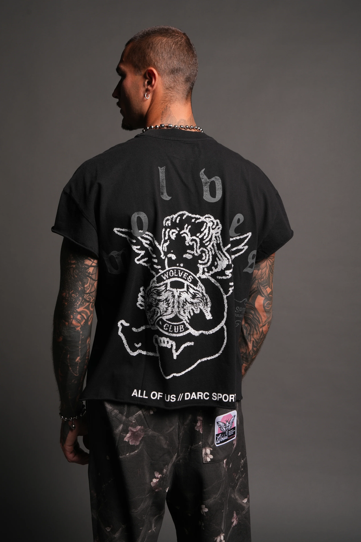 WOLVES CLUB CHERUB GRUNGE MID LENGTH RAW HEM CAP SLEEVE TEE IN BLACK